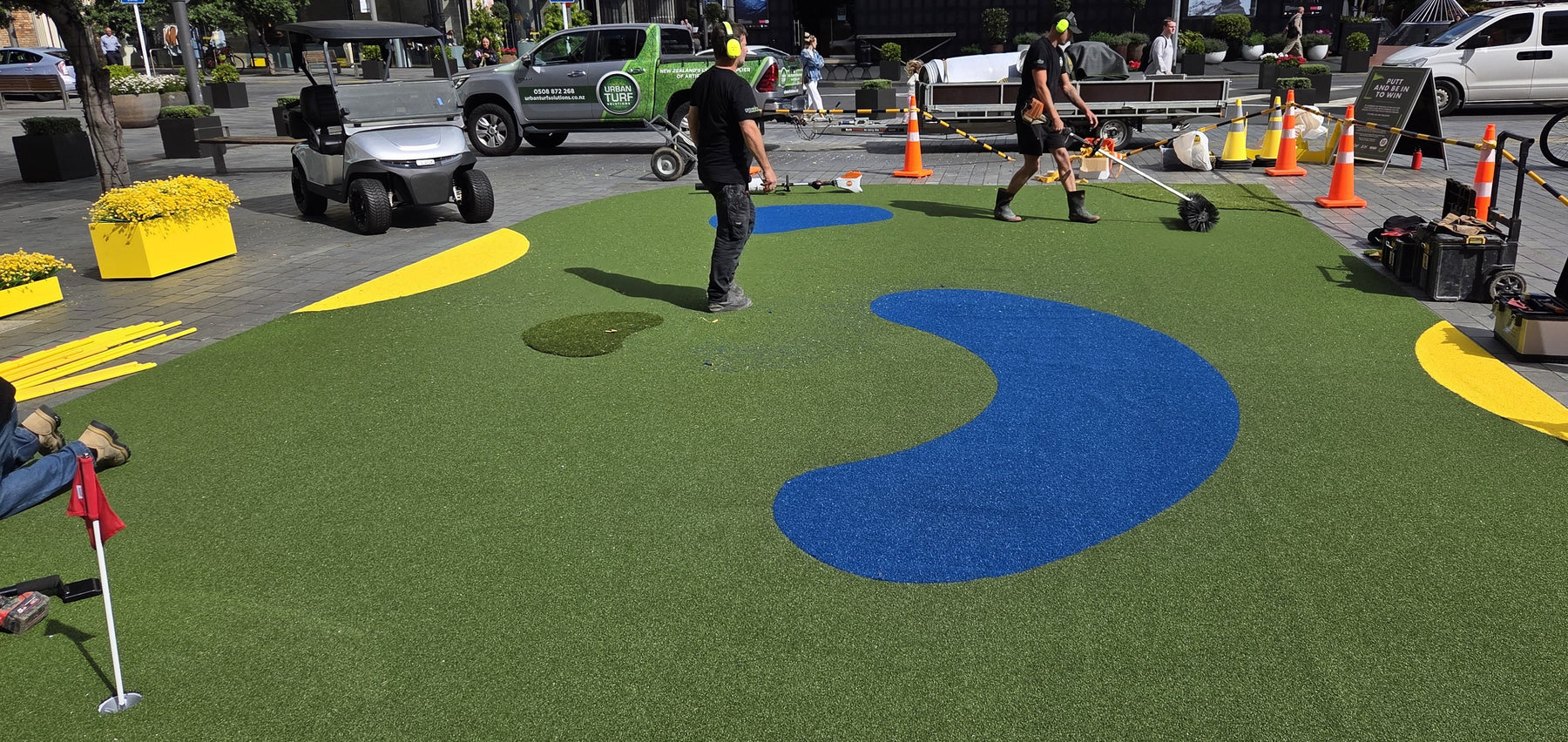 Mini golf activation at Britomart with green and blue artificial grass putting surface